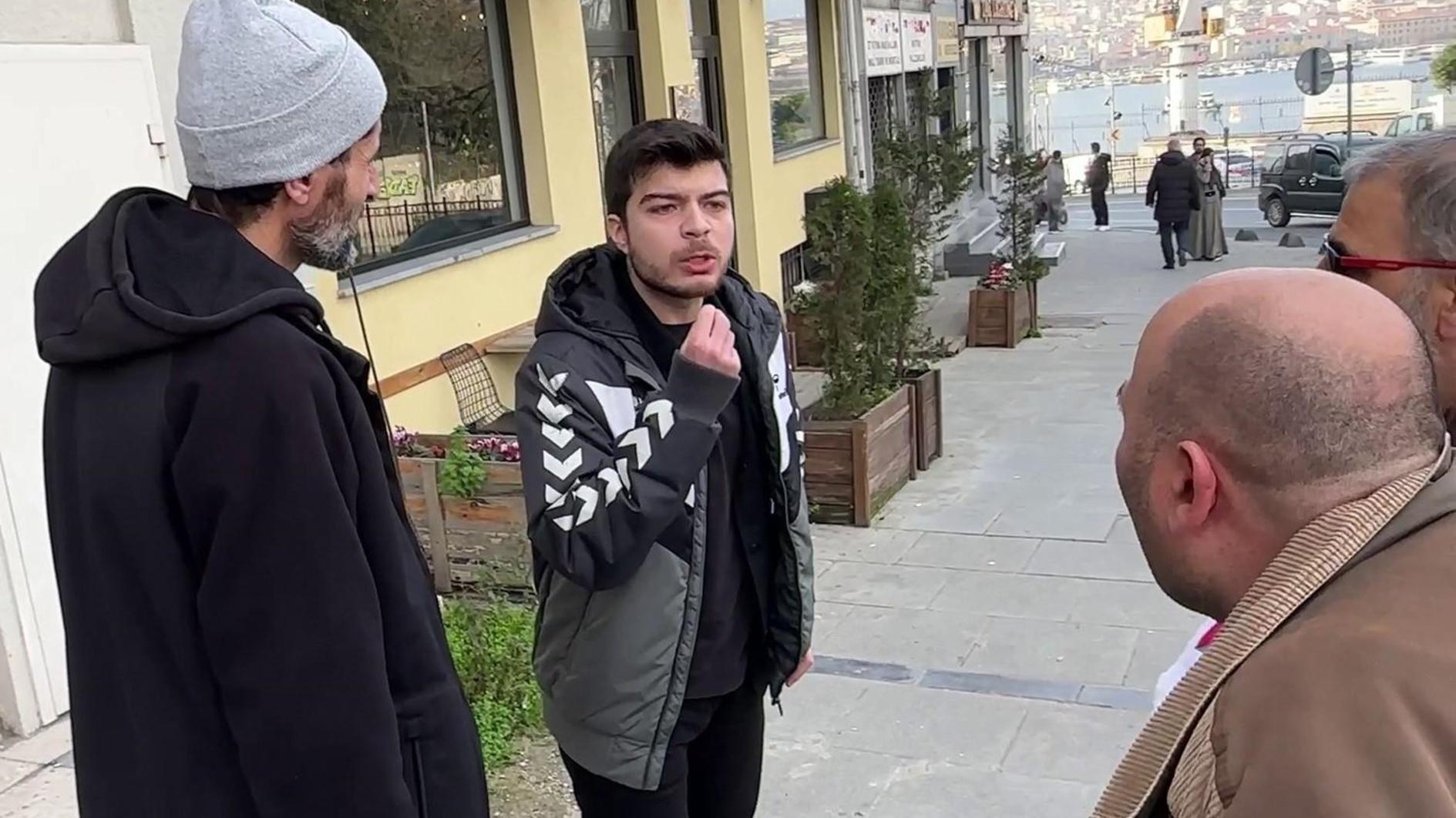 Student arrested over punching man carrying religious order flag