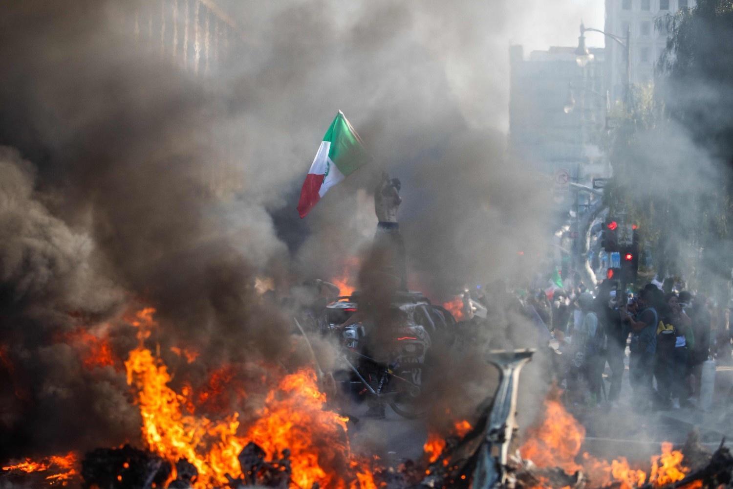 Unrest in Los Angeles over immigration raids as troops sent by Trump fan out
